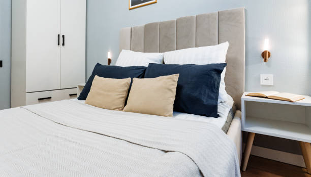 istock Modern Cozy Bedroom with Elegant Dcor and Plush Bedding 2198512372