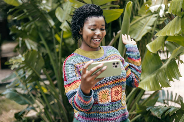 istock Bright moments brighter future young women engaging with technology outdoors 2198512844