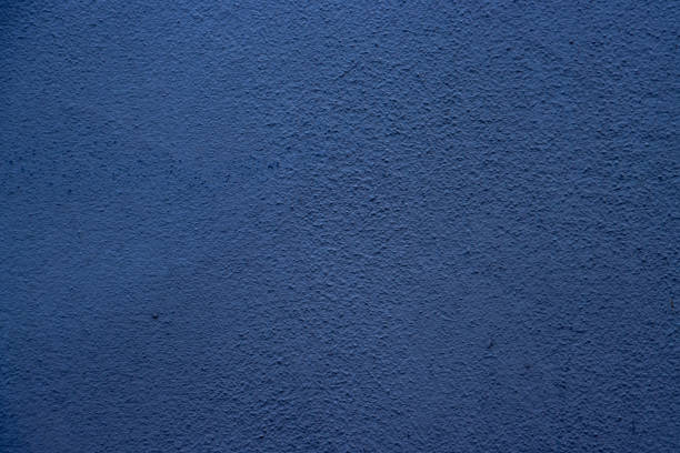 Vivid blue wall textured surface exhibiting fine details, useful as a decorative element or design background.