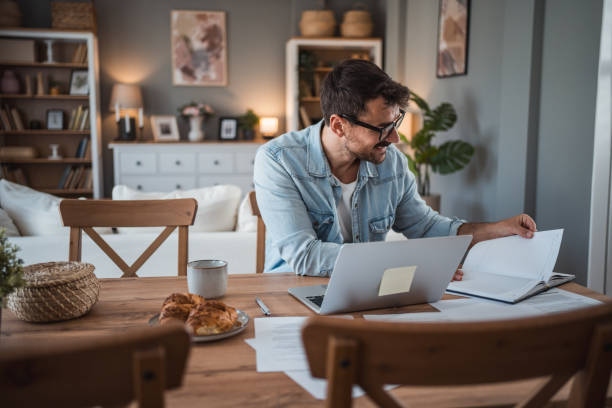 istock Man working hard in his home office 2198514415