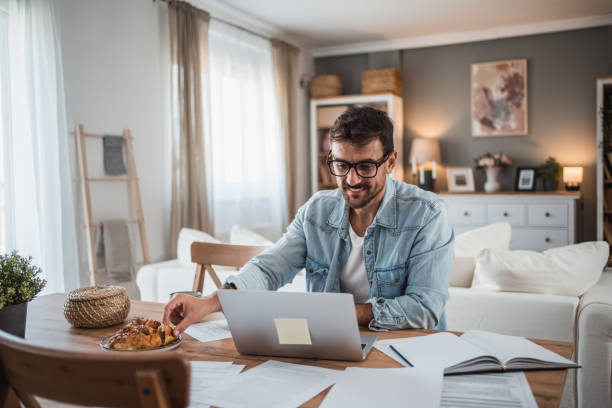 istock Man working hard in his home office 2198514460