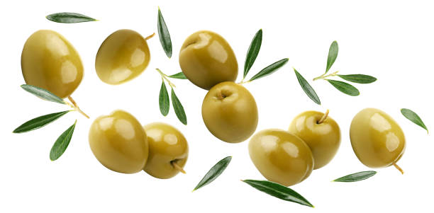 istock flying green olives with green leaves isolated on white background. clipping path 2198514509