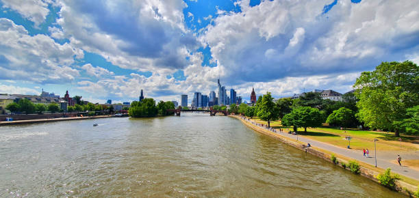 istock Frankfurt, Germany: The Main river moves towards the skyline 2198514673