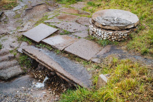 istock A manhole cover is sitting on top of a stone walkway 2198514911