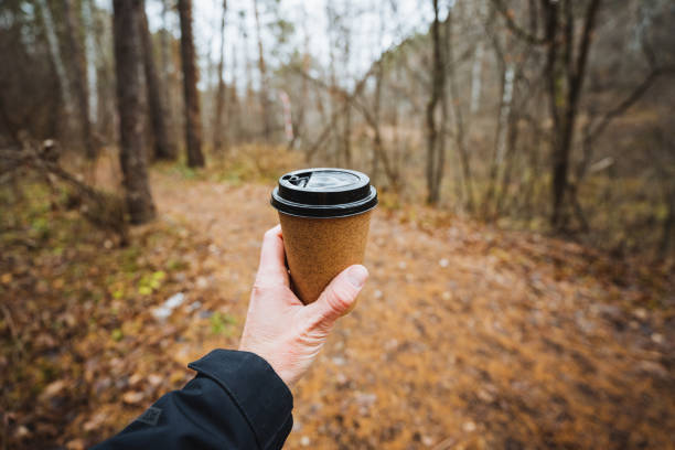 istock Relishing a cozy coffee moment, savoring every sip of a warm beverage while being surrounded by the serene tranquility of nature outdoors 2198514916