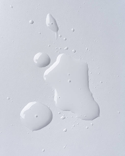 istock Abstract close-up of spilled transparent liquid on a smooth surface 2198516170