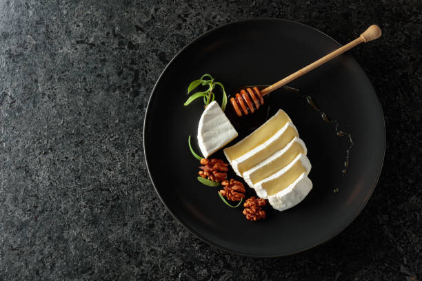 Camembert cream cheese with honey, rosemary, and walnuts.