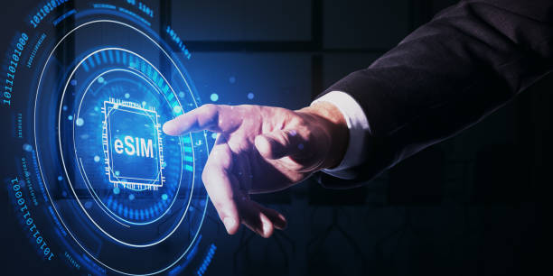istock Businessman interacting with futuristic eSIM interface. 2198516545