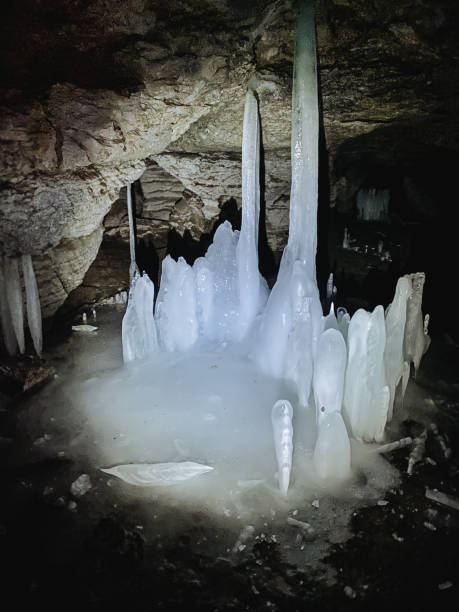 istock The breathtaking ice formations found within a cave, illuminated beautifully by a light illuminating through them, create a mesmerizing spectacle of natures artistry and wonder 2198517041