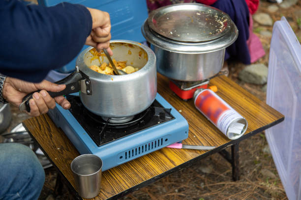 istock Camp Cooking Using Portable Stoves with Fresh Ingredients Outdoors 2198518699