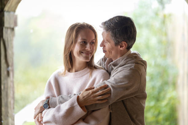 istock Romantic couple embracing at home, expressing love and affection 2198518787
