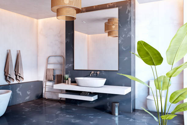 istock Modern bathroom interior with minimalist design featuring marble walls, large mirror, rattan accents, and lush green plant decor. 3D Rendering 2198518895