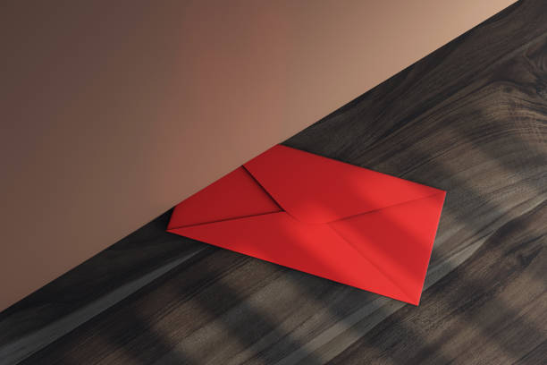 Red envelope on a wooden floor under a door, soft evening light, modern interior design, symbolizing communication and message concept. 3D Rendering.