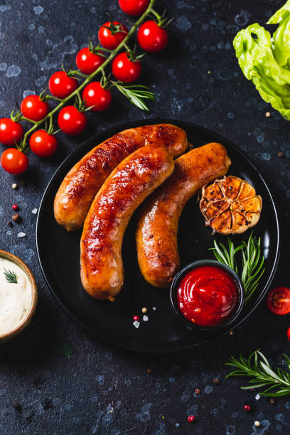 istock Fried sausages with vegetables and garlic 2198521254