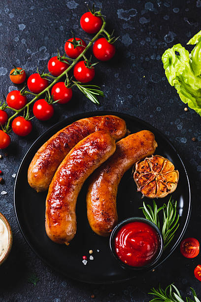 istock Fried sausages with vegetables and garlic 2198521279