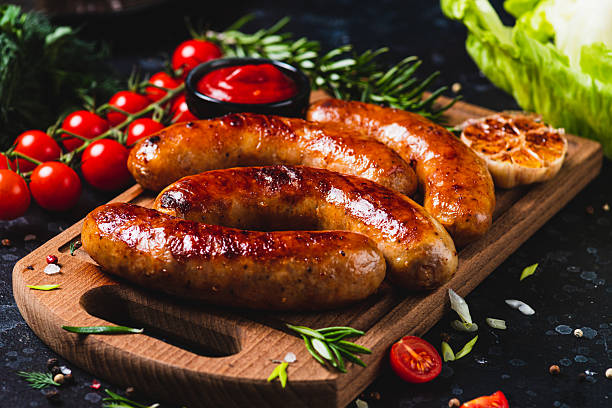 istock Fried sausages with vegetables and garlic 2198521295