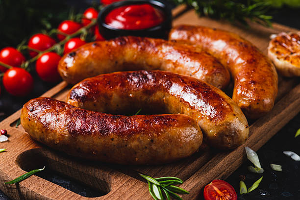 istock Fried sausages with vegetables and garlic 2198521298