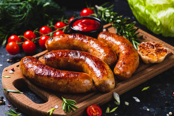 istock Fried sausages with vegetables and garlic 2198521311