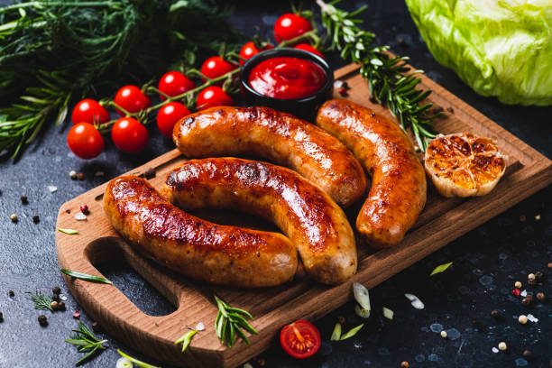 istock Fried sausages with vegetables and garlic 2198521326