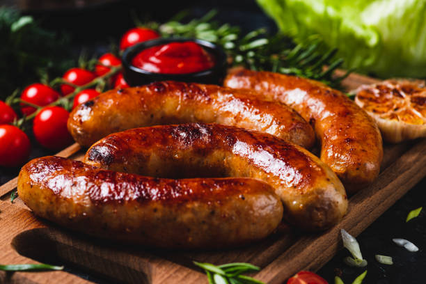 istock Fried sausages with vegetables and garlic 2198521378