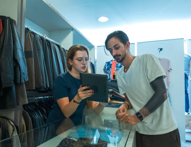 istock Customer Service Interaction in Clothing Store 2198521455