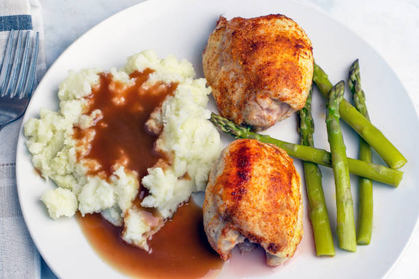 istock seasoned chicken thighs with mashed potatoes 2198521784