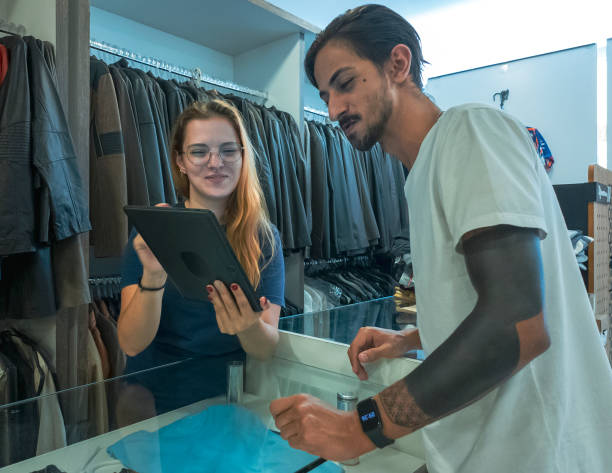 istock Customer Service Interaction in Clothing Store 2198521895