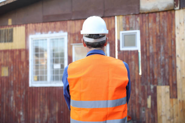 Back view of the engineer in worker helmet