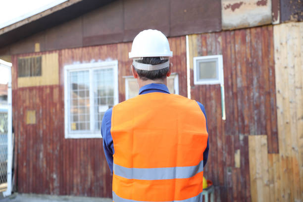 Back view of the engineer in worker helmet