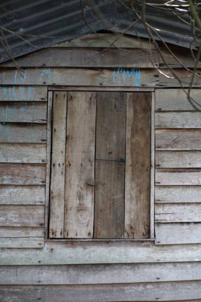 istock Rustic Wooden Shed Detail with Weathered Texture and Paint Drips Backdrop 2198523514
