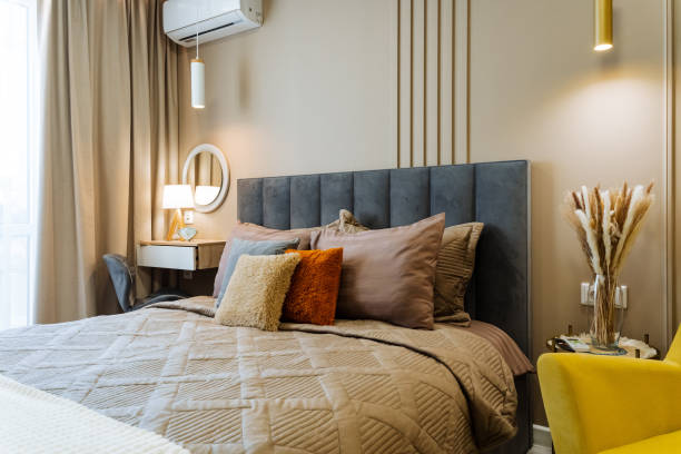 This Elegant and Cozy Bedroom Interior features a Modern Design complemented by Warm Accents that make it feel both inviting and stylish