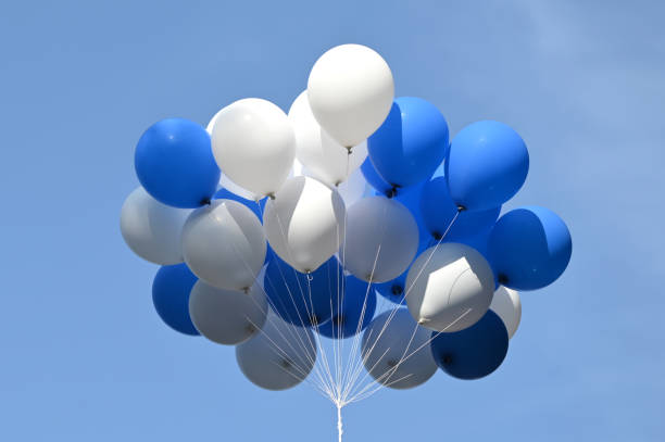 istock Bunch of balloons in sky 2198530352