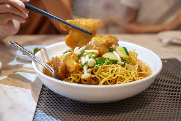 istock Crispy Noodles with Glazed Fish and Vegetables 2198531150
