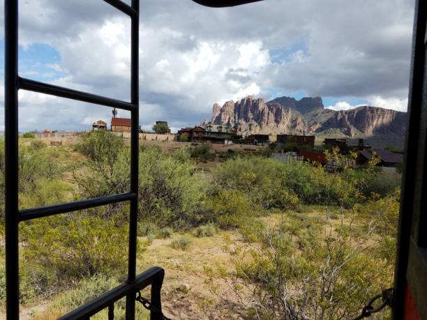 Riding the Narrow Gauge Railroad Tour through the Arizona Desert at Goldfield Ghost Town, Looking at the Superstition Mountains. High quality photo