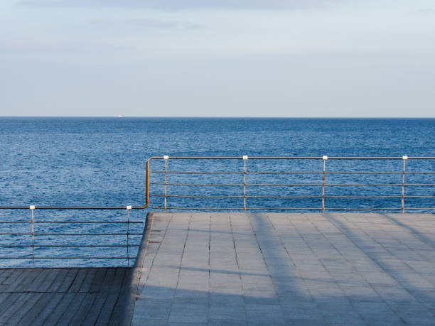 istock Plank ledge with handrails by the sea 2198534760