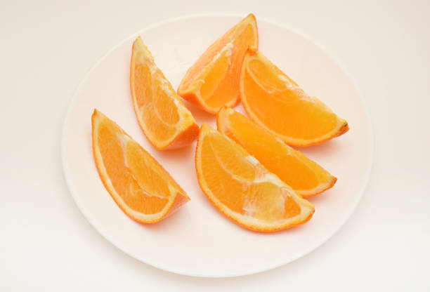 Sliced orange slices on a plate. Juicy orange.