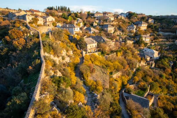 istock Old village nestled in colorful tree landscape 2198542369