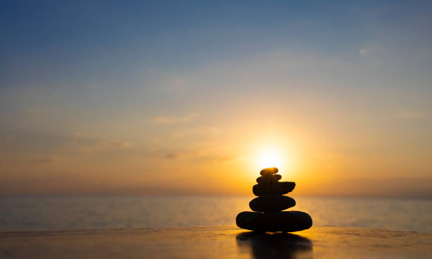 istock Zen stones by the sea with blurred horizon 2198543220