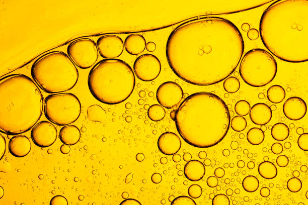 istock Close up macro lemon bubble texture,Lemon texture, macro. Abstract yellow summer background,Fresh lemon slice in water with bubbles on white background 2198544928