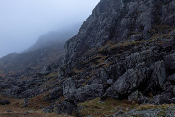 istock Rocks on mountainside in Moelwyn range on misty day, Tanygrisiau, Blaenau Ffestiniog, Gwynedd, Snowdonia National Park, Wales, Britain 2198546242