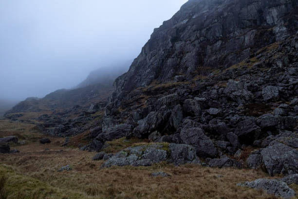 istock Rocks on mountainside in Moelwyn range on misty day, Tanygrisiau, Blaenau Ffestiniog, Gwynedd, Snowdonia National Park, Wales, Britain 2198546245