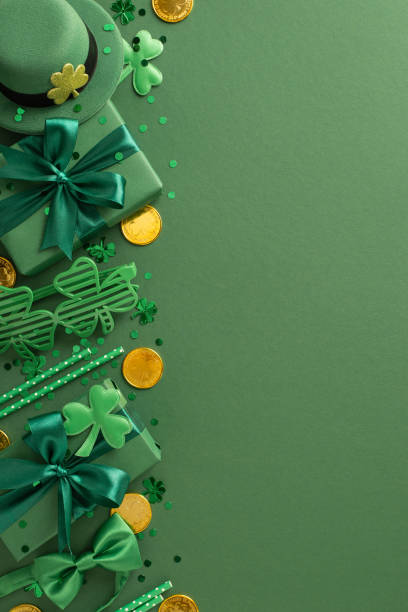 istock Decorative St Patrick's Day layout featuring vibrant green gifts, clovers, hats, coins, bows, and festive items neatly arranged on a green backdrop 2198550713
