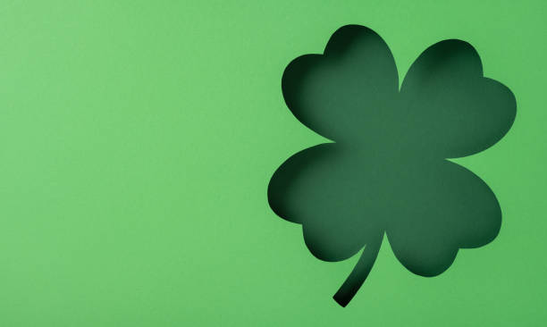istock A four-leaf clover cutout silhouette on a green background symbolizing luck and prosperity 2198550748