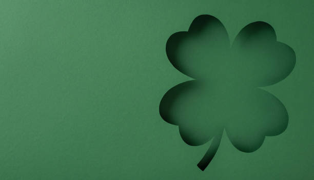 istock Clover-shaped cutout on a green background, perfect for St. Patrick's Day themes or designs 2198550759