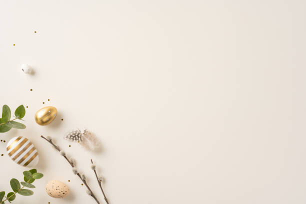 istock Minimalistic composition featuring gold and striped Easter eggs paired with green foliage and branches. Perfect for festive greetings, seasonal concepts, or elegant holiday decoration themes 2198550800