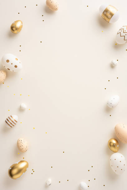 istock Golden and white vertical Easter eggs arranged on a beige surface with confetti, creating a festive and elegant atmosphere, perfect for holiday celebrations or chic decorations 2198550804