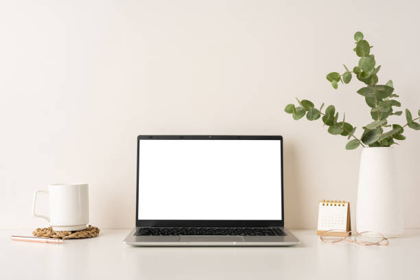 istock A clean and minimalistic workspace featuring a laptop, white coffee mug, and desk accessories 2198550809