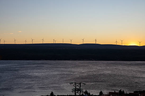 istock Scenic View of Windswept Turbines at Dusk Time 2198551463
