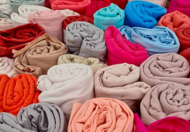 istock Colorful cloth rolls forming a vibrant textile background 2198551862