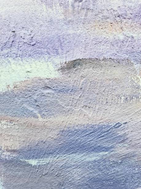 istock Light purple and white paint creating abstract design on textured wall 2198551915